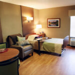 a patient room at Ellicott City Healthcare Center with a single bed and chair
