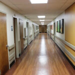 a hallway of patient rooms at Marley Neck Health And Rehabilitation Center